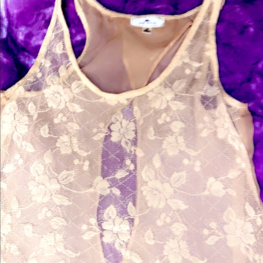 A handmade blouse with an opening in the back you can pair with a tank top.